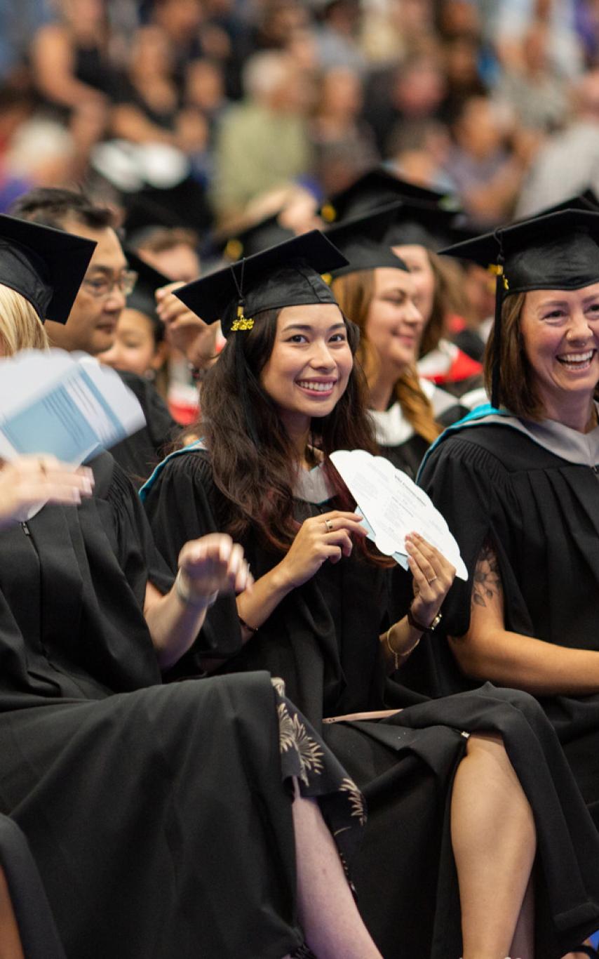 Group of happy VIU graduates